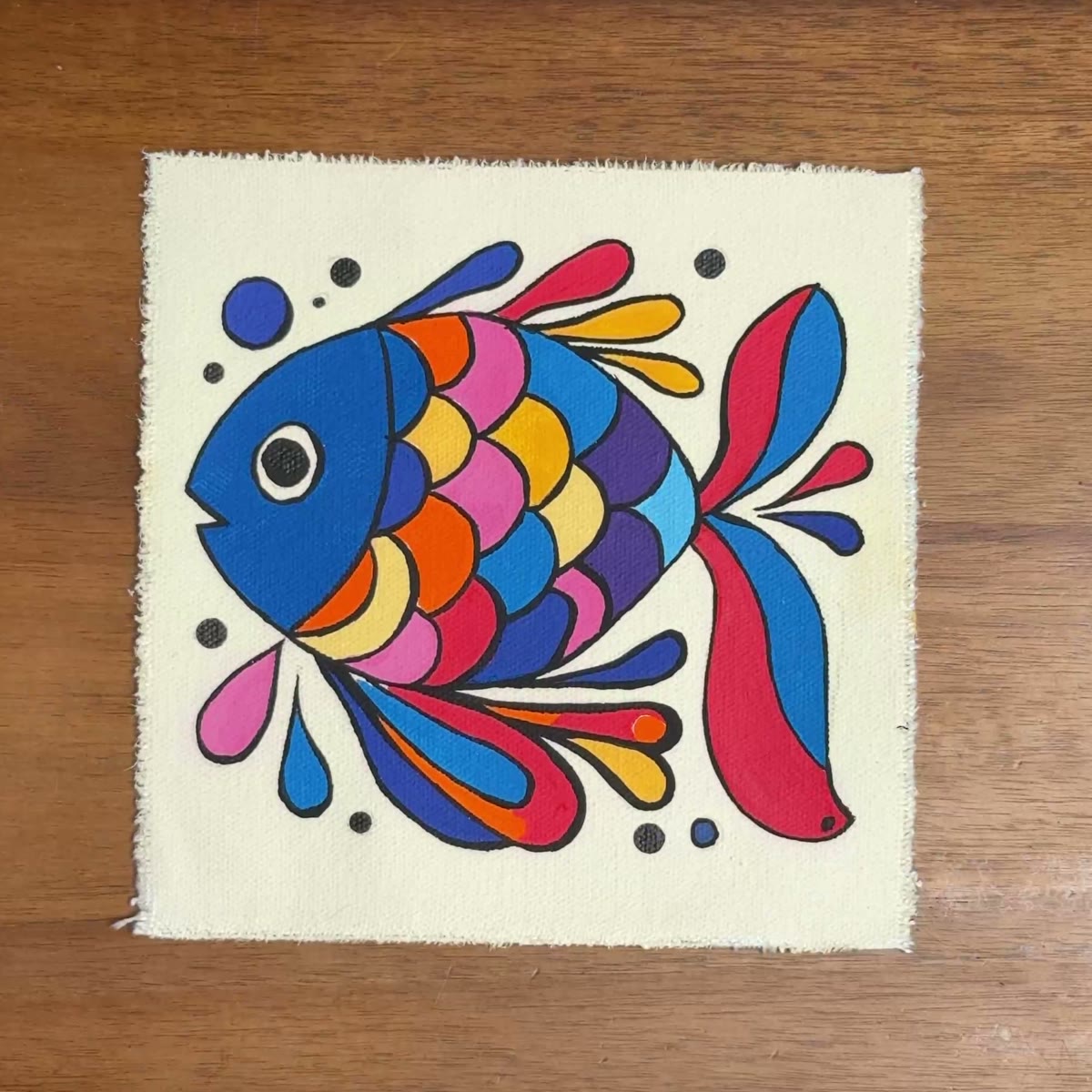 The folk fish painting on the studio table